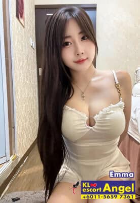 Emma wearing a white sheer sweetheart neckline dress offering girlfriend experience escort KL.