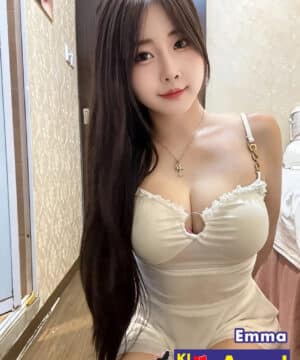 Emma wearing a white sheer sweetheart neckline dress offering girlfriend experience escort KL.