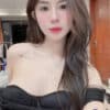 Zoe wearing an off-shoulder black corseted dress with clavicle tattoo offering top rated model companion KL services.