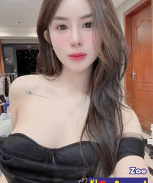 Zoe wearing an off-shoulder black corseted dress with clavicle tattoo offering top rated model companion KL services.